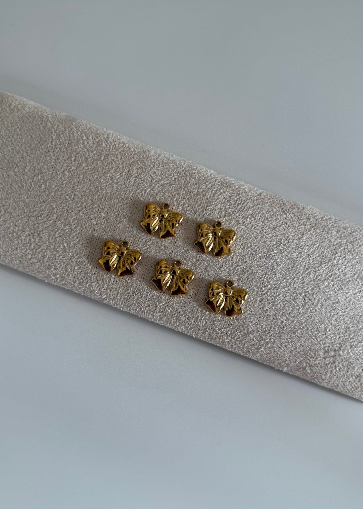 Pendentifs en acier inoxydable “bow tie”